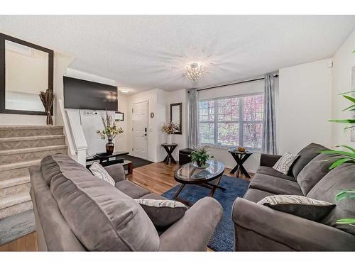 233 Eversyde Boulevard Sw, Calgary, AB - Indoor Photo Showing Living Room