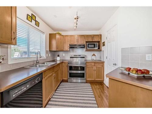233 Eversyde Boulevard Sw, Calgary, AB - Indoor Photo Showing Kitchen With Double Sink