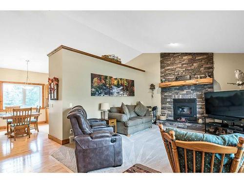 112 Derochie Drive, Claresholm, AB - Indoor Photo Showing Living Room With Fireplace