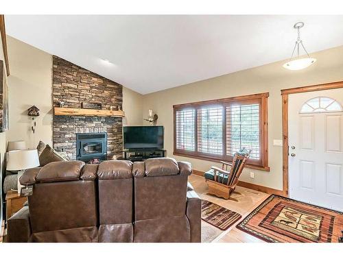 112 Derochie Drive, Claresholm, AB - Indoor Photo Showing Living Room With Fireplace