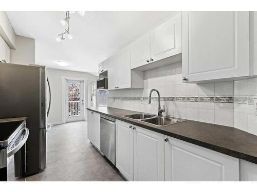 113 Country Village Cape Ne, Calgary, AB - Indoor Photo Showing Kitchen With Stainless Steel Kitchen With Double Sink