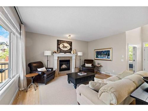 151 Tuscany Estates Close Nw, Calgary, AB - Indoor Photo Showing Living Room With Fireplace