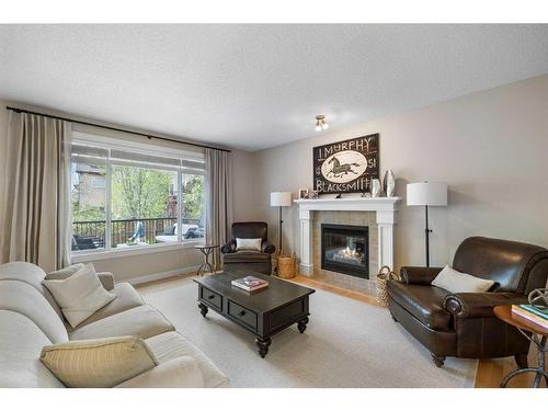 151 Tuscany Estates Close Nw, Calgary, AB - Indoor Photo Showing Living Room With Fireplace
