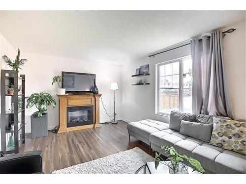 3917 29 Avenue Se, Calgary, AB - Indoor Photo Showing Living Room With Fireplace