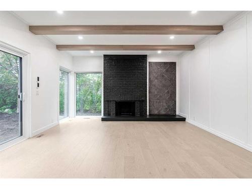 120 Oakcliffe Place Sw, Calgary, AB - Indoor With Fireplace