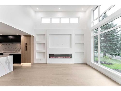 120 Oakcliffe Place Sw, Calgary, AB - Indoor With Fireplace