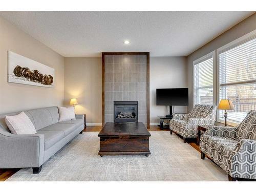 101 Legacy Green Se, Calgary, AB - Indoor Photo Showing Living Room With Fireplace