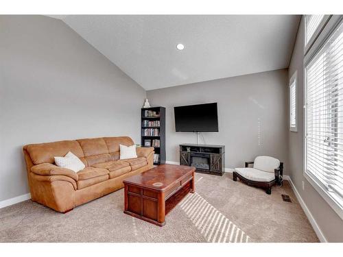 101 Legacy Green Se, Calgary, AB - Indoor Photo Showing Living Room With Fireplace