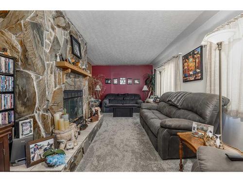 240037 Range Road 31, Rural Rocky View County, AB - Indoor Photo Showing Living Room With Fireplace