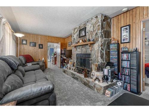 240037 Range Road 31, Rural Rocky View County, AB - Indoor Photo Showing Living Room With Fireplace