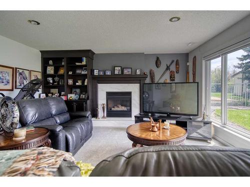 505 Lakeside Greens Place, Chestermere, AB - Indoor Photo Showing Living Room With Fireplace