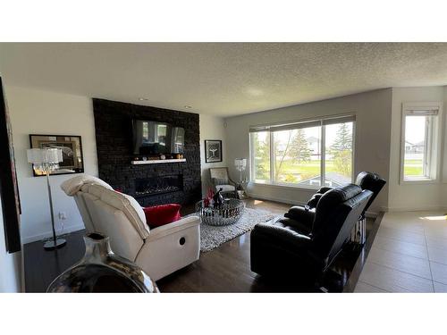 505 Lakeside Greens Place, Chestermere, AB - Indoor Photo Showing Living Room With Fireplace