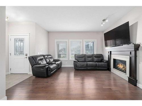 25 Redstone Villas Ne, Calgary, AB - Indoor Photo Showing Living Room With Fireplace