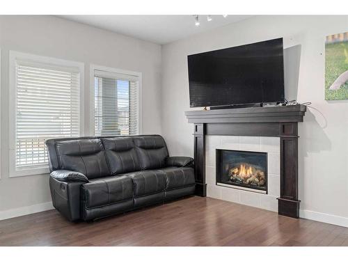 25 Redstone Villas Ne, Calgary, AB - Indoor Photo Showing Living Room With Fireplace