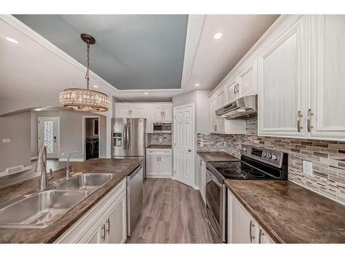 74 Canals Circle Sw, Airdrie, AB - Indoor Photo Showing Kitchen With Double Sink With Upgraded Kitchen