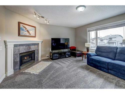 21 Harvest Park Court Ne, Calgary, AB - Indoor Photo Showing Living Room With Fireplace