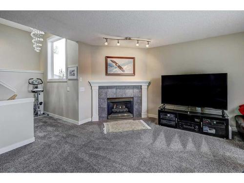 21 Harvest Park Court Ne, Calgary, AB - Indoor Photo Showing Living Room With Fireplace