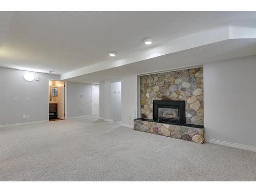 7 Cathedral Road Nw, Calgary, AB - Indoor Photo Showing Living Room With Fireplace