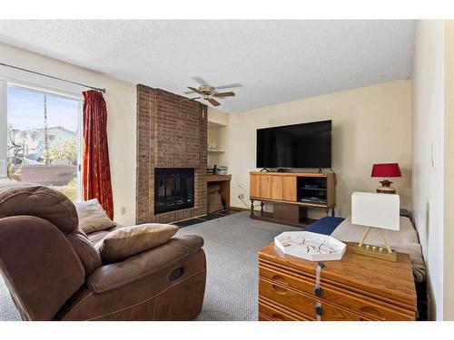 236 Templeby Place Ne, Calgary, AB - Indoor Photo Showing Living Room With Fireplace