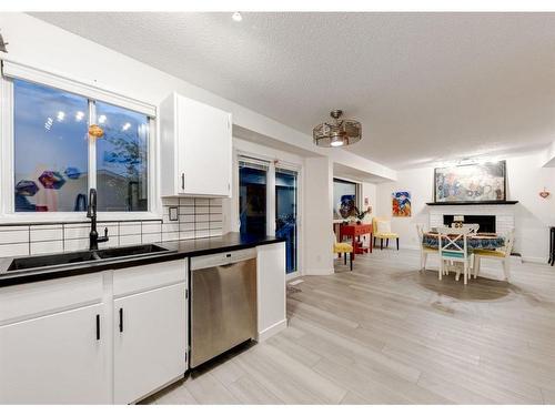 16283 10 Street Sw, Calgary, AB - Indoor Photo Showing Kitchen With Double Sink