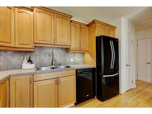 143 Sackville Drive Sw, Calgary, AB - Indoor Photo Showing Kitchen With Double Sink