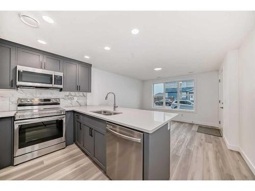330 Lucas Avenue Nw, Calgary, AB - Indoor Photo Showing Kitchen With Stainless Steel Kitchen With Double Sink