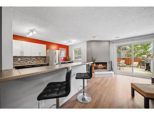 56 Hawkville Place Nw, Calgary, AB - Indoor With Fireplace