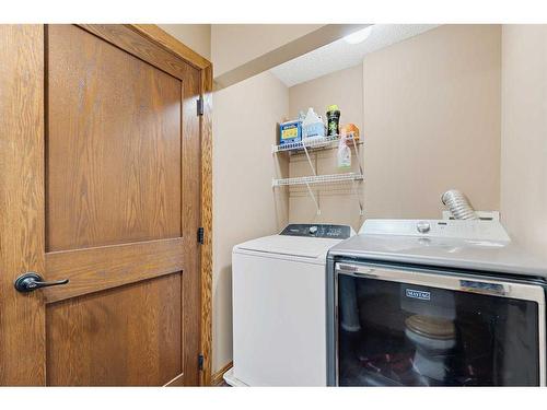 112 Hidden Ranch Close Nw, Calgary, AB - Indoor Photo Showing Laundry Room