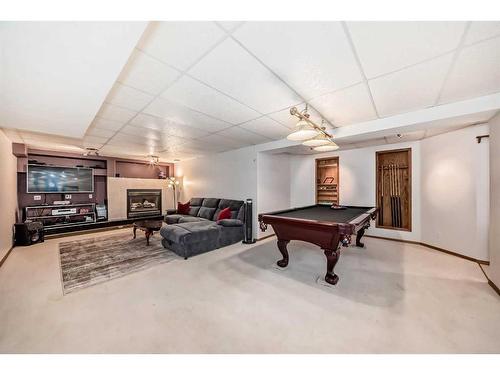 15880 Mckenzie Lake Way Se, Calgary, AB - Indoor Photo Showing Other Room With Fireplace