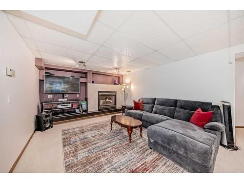 15880 Mckenzie Lake Way Se, Calgary, AB - Indoor Photo Showing Other Room With Fireplace