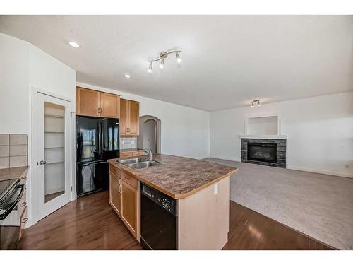 70 Panamount Villas Nw, Calgary, AB - Indoor Photo Showing Kitchen With Fireplace With Double Sink
