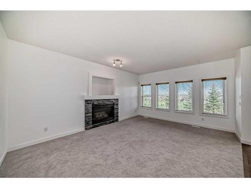70 Panamount Villas Nw, Calgary, AB - Indoor Photo Showing Other Room With Fireplace