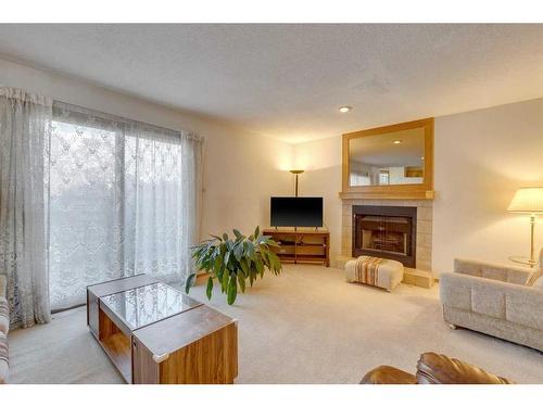 76 Ventura Way Ne, Calgary, AB - Indoor Photo Showing Living Room With Fireplace
