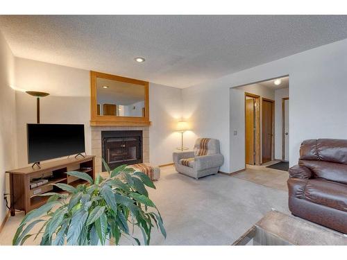 76 Ventura Way Ne, Calgary, AB - Indoor Photo Showing Living Room With Fireplace