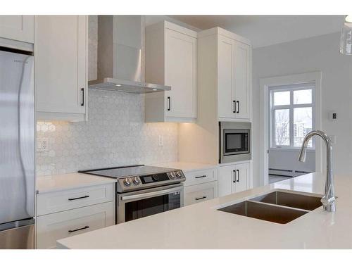8206-1802 Mahogany Boulevard Se, Calgary, AB - Indoor Photo Showing Kitchen With Double Sink With Upgraded Kitchen