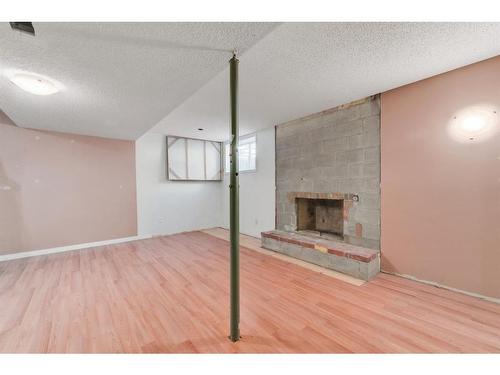 37 Midridge Green Se, Calgary, AB - Indoor With Fireplace
