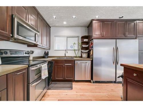 37 Midridge Green Se, Calgary, AB - Indoor Photo Showing Kitchen With Double Sink