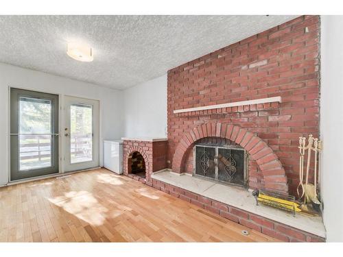 37 Midridge Green Se, Calgary, AB - Indoor Photo Showing Other Room With Fireplace