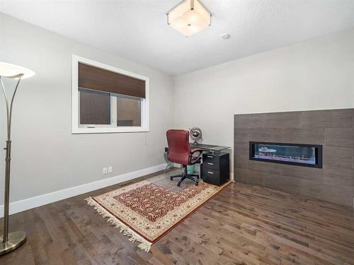 14 West Grove Point Sw, Calgary, AB - Indoor With Fireplace