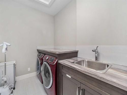 14 West Grove Point Sw, Calgary, AB - Indoor Photo Showing Laundry Room