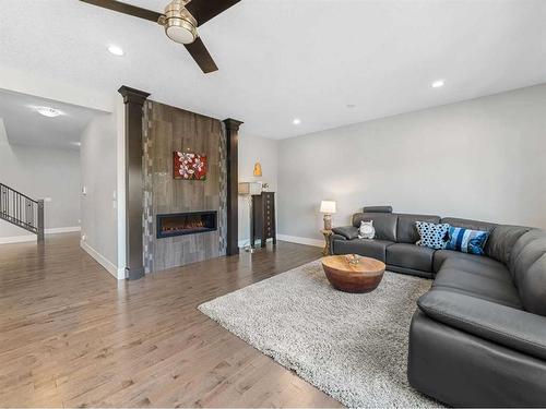 14 West Grove Point Sw, Calgary, AB - Indoor Photo Showing Living Room With Fireplace
