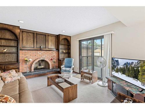 64 Bedford Circle Ne, Calgary, AB - Indoor Photo Showing Living Room With Fireplace