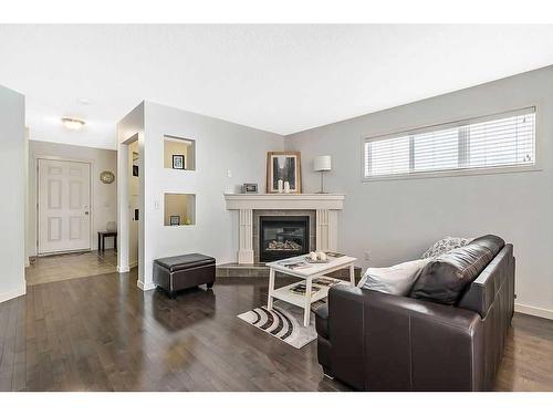 524 Cranston Drive Se, Calgary, AB - Indoor Photo Showing Other Room With Fireplace