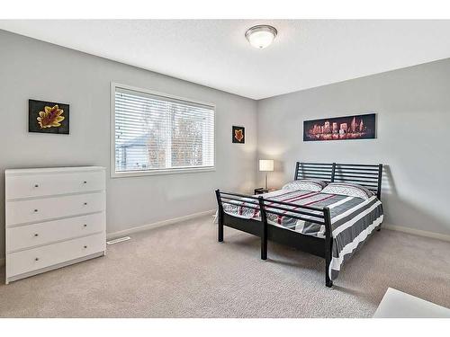 524 Cranston Drive Se, Calgary, AB - Indoor Photo Showing Bedroom
