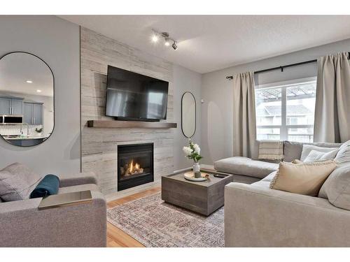 8009 Cougar Ridge Avenue Sw, Calgary, AB - Indoor Photo Showing Living Room With Fireplace