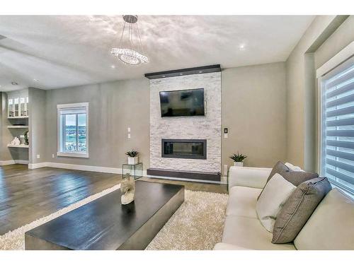 131 Evansview Road Nw, Calgary, AB - Indoor Photo Showing Living Room With Fireplace