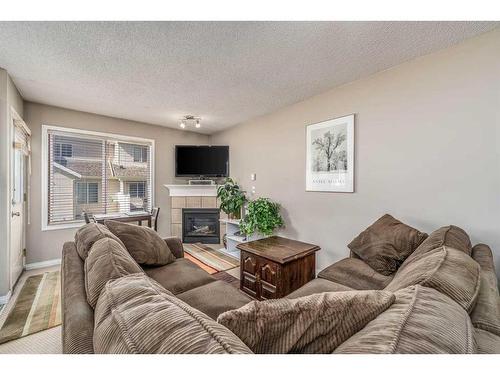 22 Royal Oak Gardens Nw, Calgary, AB - Indoor Photo Showing Living Room With Fireplace