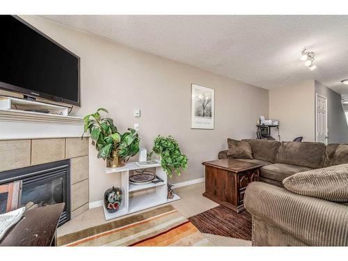 22 Royal Oak Gardens Nw, Calgary, AB - Indoor Photo Showing Living Room With Fireplace