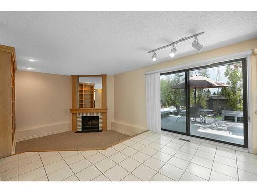 168 Coachwood Crescent Sw, Calgary, AB - Indoor With Fireplace