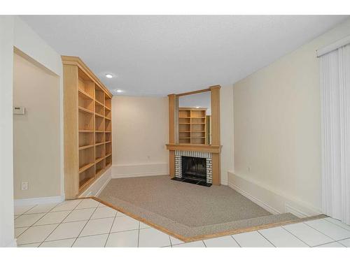 168 Coachwood Crescent Sw, Calgary, AB - Indoor With Fireplace